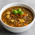 Lentil Potato Soup in a rustic bowl with vegetables