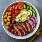 Mediterranean Steak Bowl with steak, veggies, and tzatziki