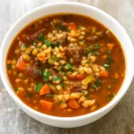 Pioneer Woman Beef Barley Soup in rustic bowl
