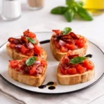 Cute Heart-Shaped Bruschetta on rustic board with tomatoes and basil