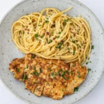 Garlic Butter Chicken Pasta served with Parmesan and parsley
