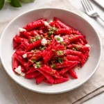 Pink Creamy Vegan Pasta in a white bowl