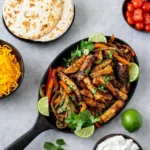 Blackstone Fajitas sizzling on outdoor griddle