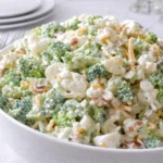 Deliciously Sweet Broccoli Cauliflower Salad in white bowl