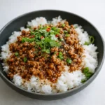 Honey Garlic Ground Turkey in skillet with sesame seeds