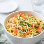 Lemon Capellini Salad in a bowl with lemon zest