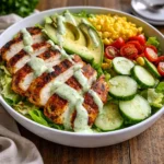 A fresh Grilled Chicken Avocado Salad with green goddess dressing.