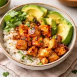 A vibrant Hot Honey Chicken Bowl with glazed chicken, broccoli, and sweet potatoes.