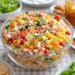 Layered Pasta Salad in a clear bowl