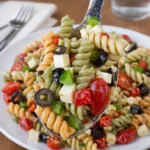 Pasta Salad For A Crowd in a large wooden bowl