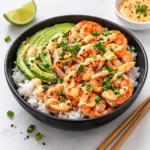 A colorful and healthy Shrimp Rice Bowl with succulent shrimp and vegetables.