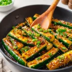 Simple Soy Glazed Hibachi Zucchini on a plate with sesame seeds