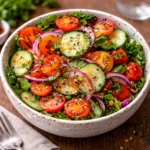 Fresh Garden Salad in a wooden bowl with tomatoes and cucumbers