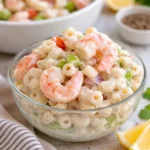Refreshing Shrimp Pasta Salad in a white bowl on a wooden table