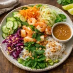 Fresh Spring Roll Salad with Peanut Dressing in a white bowl